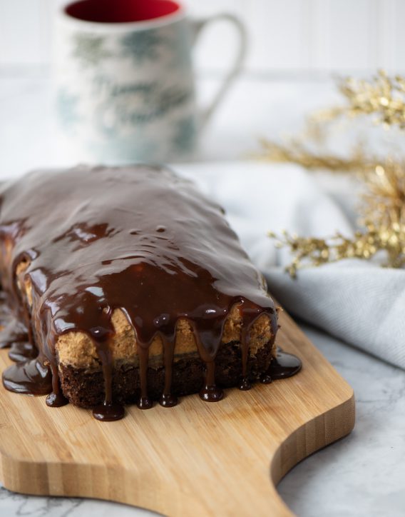 Chocolate Coffee Loaf Cake on a wooden bread chopping board served in Christmas Day.