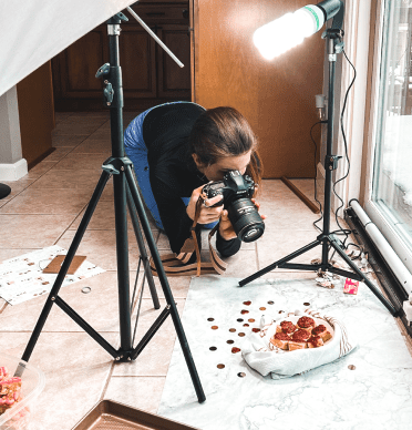 Casey Kolp capturing an image of cake bites with styling.
