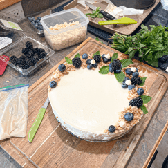 Preparing blueberry cheesecake for food styling and photography.