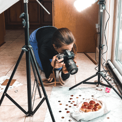 Casey Kolp taking a photo of cake bites.