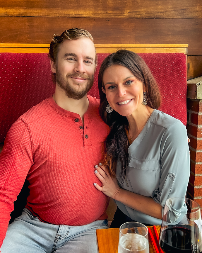 Casey Kolp with her husband in a restaurant.