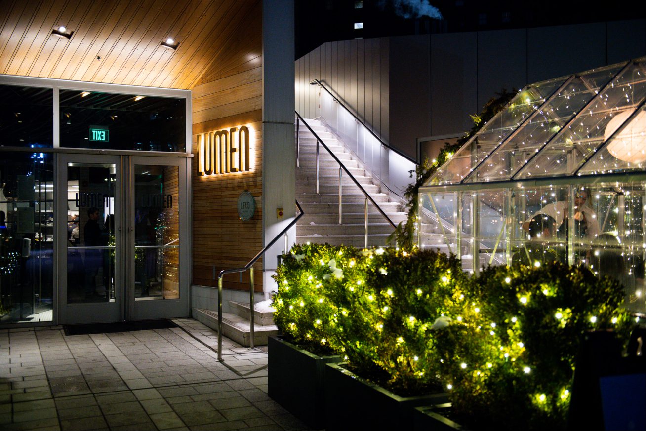 Lumen Detroit outdoor dining area and entrance signage.