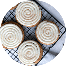 Circular photo of soft snickerdoodle cookies on a tray.