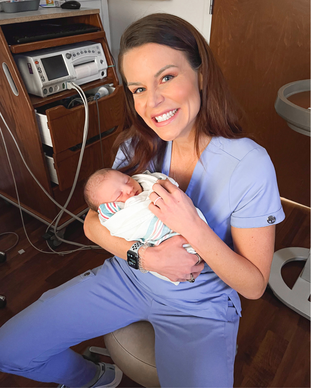Casey Kolp holding an infant